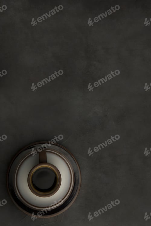 Preview: Dark espresso in a brown design cup