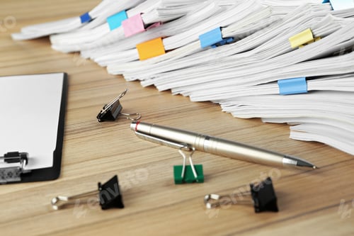 Preview: Stack of documents with binder clips, clipboard and pen on wooden table, closeup view