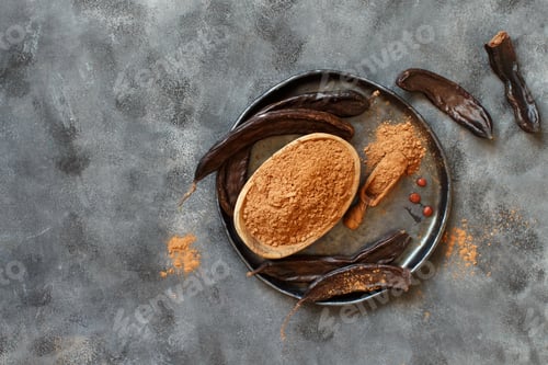 Preview: Dry carob powder and pods top view