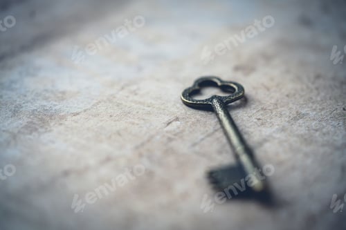 Preview: Closeup of an antique key on a wooden surface