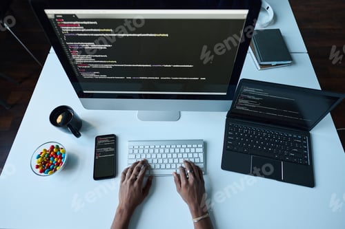 Preview: Developer working on computer at his workplace