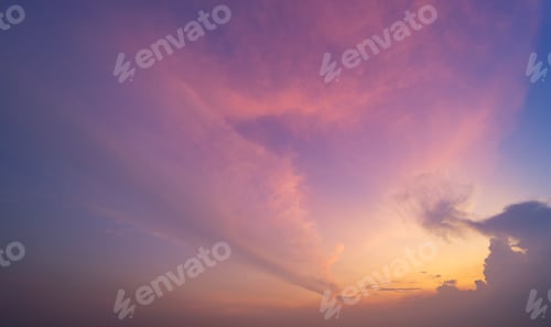 Preview: Sunset sky. Abstract nature background. Dramatic blue and orange, colorful clouds at twilight time.