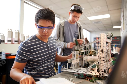 Preview: Two Male College Students Building Machine In Science Robotics Or Engineering Class