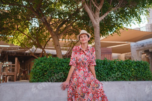 Preview: Young female tourist exploring iconic landmarks of the United Arab Emirates.