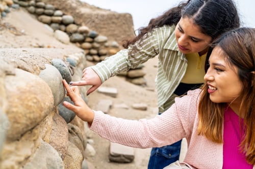 Preview: Tourists exploring ancient pre inca ruins in coastal desert