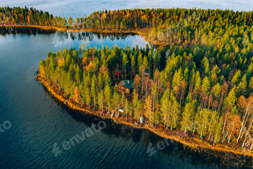 Preview: Aerial view of fall autumn forest with golden leaves and blue lakes