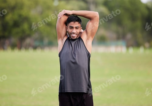 Preview: He who has health has hope. Shot of a handsome young man stretching before his outdoor run.