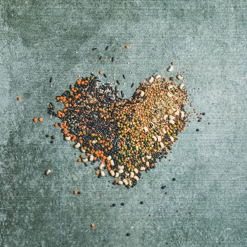Preview: Various raw grains, beans, cereals in shape of heart