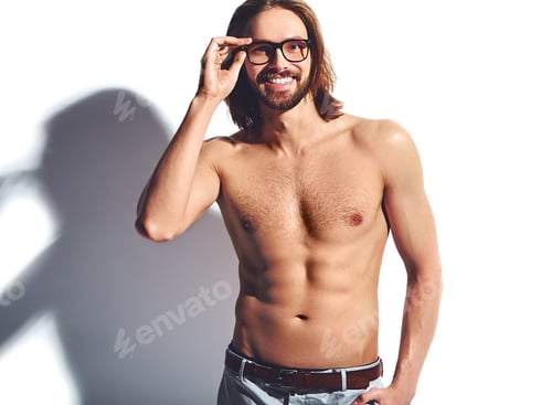 Preview: Portrait of young handsome man posing in studio