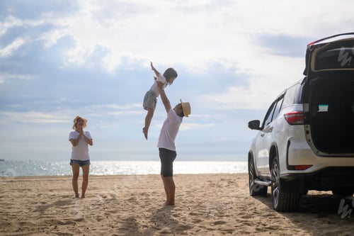 Preview: Happy Asian family travel on beach on holiday