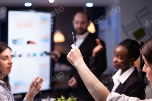 Preview: Selective focus of businesswoman leder sitting at desk analyzing marketing presentation discussing