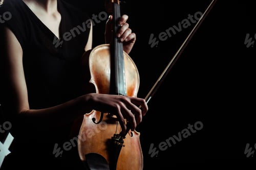Preview: partial view of female musician playing on violin isolated on black