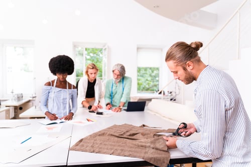Preview: Team of fashion designers at work