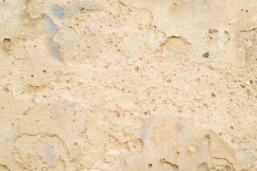 Preview: Rough texture background of destroyed old wall made of concrete, sand and small stones