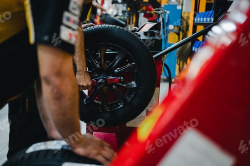 Preview: Technical man repairs, maintenance and set the wheel center.