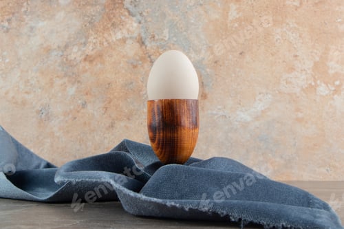 Preview: Boiled egg on marble background with cloth