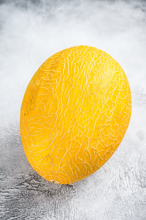 Preview: Whole yellow ripe melon. White background. Top view