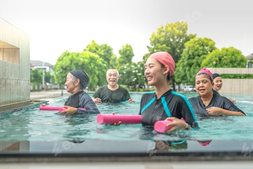 Preview: senior aquatic class practicing water relaxation