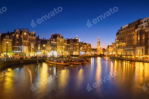 Preview: Amsterdam, Netherlands. Evening cityscape. Dark sky and city lights. Dutch canals.