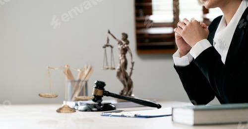 Preview: Female lawyer sitting at her desk office.