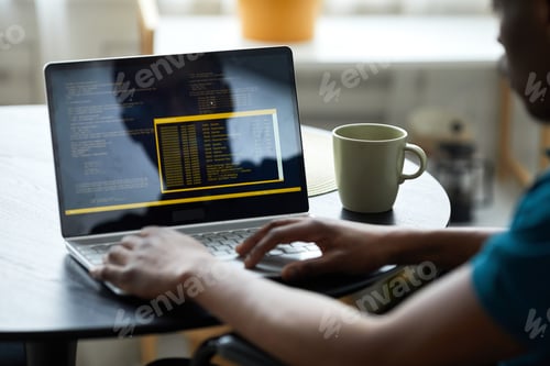 Preview: Man with Disability Programming Software Code Closeup