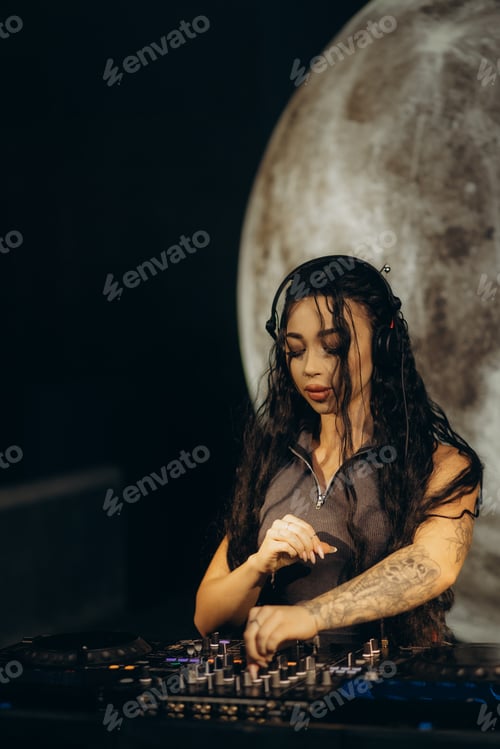 Preview: Female DJ Playing Music at a Nightclub with a Vibrant Stage Setup