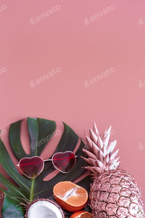 Preview: Pineapple with tropical leaf and glasses on a colored background. summer tropical concept