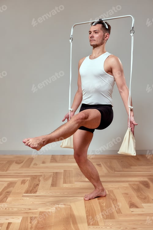 Preview: Man doing exercise on pilates reformer, pilates gymnastics reformer, balance training with reformer