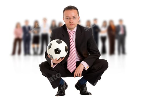 Preview: Business Man With A Football And A Group Isolated Over A White Background