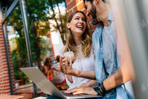 Preview: Happy couple in love using digital devises for work, study or social media.