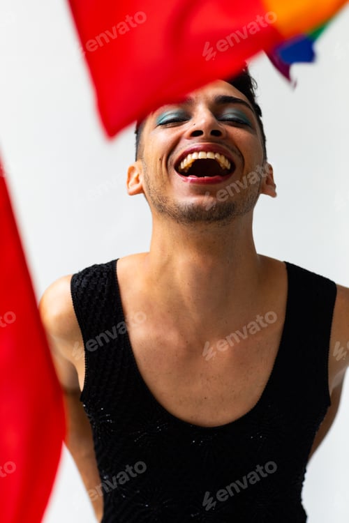 Preview: Portrait of happy biracial transgender man, with rainbow flag on white background