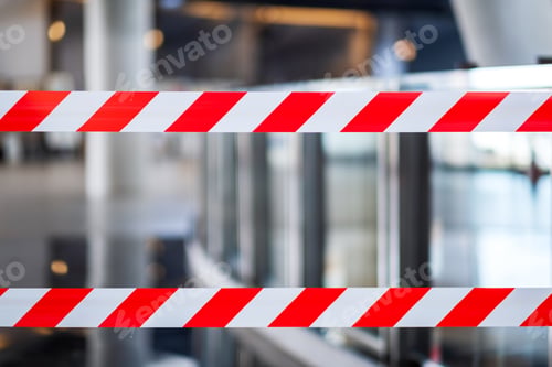 Preview: Red and white warning tape stretched across danger area in the building