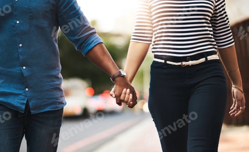 Preview: Love, never let it go. Cropped shot of an affectionate couple holding hands outdoors.