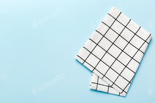 Preview: top view with white empty kitchen napkin isolated on table background.