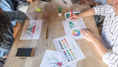 Preview: Close up of creative businessteam using infographic and discussing about new marketing plan