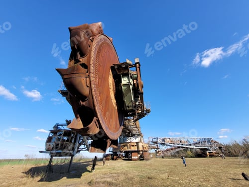 Preview: Bucket-wheel excavator Bagger in a reen field under the clear sky