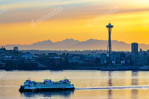 Preview: Ferry on the water with the city of Seattle, USA under the beautiful sunset in the background