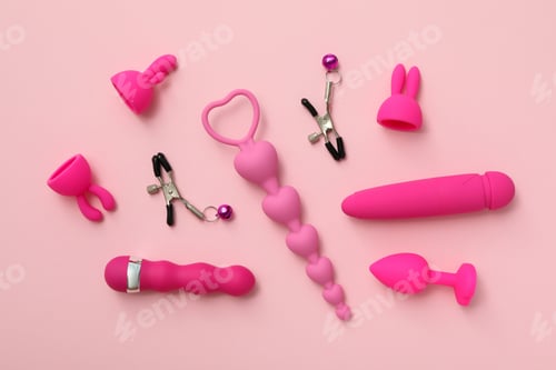 Preview: Collection of sex toys, on a pink background.