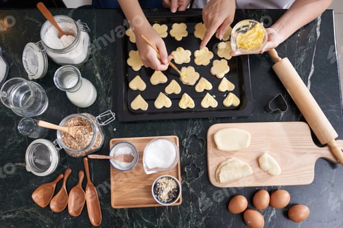 Preview: Woman Buttering Raw Cookies