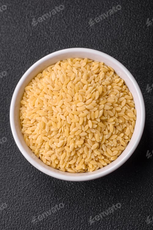 Preview: Raw whole grain orzo pasta as an ingredient for a delicious dish