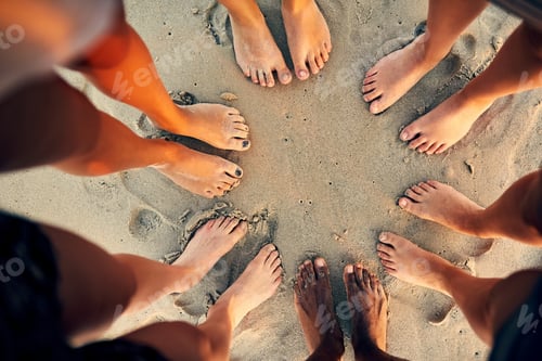 Preview: Sandy toes and salty seas is just what we need. Shot of young people hanging out at the beach.
