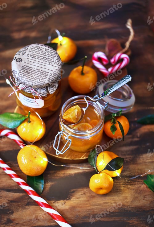 Preview: Holiday sweets - tangerines in syrup or jam or confiture on christmas background