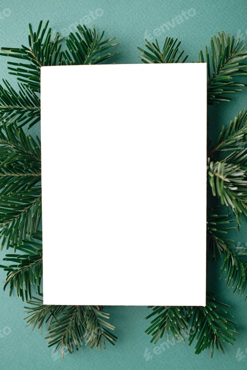 Preview: Christmas card mock up. Modern greeting card flat lay with green fir branches on green background