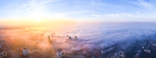 Preview: Golden Hour View of Tarnow Hidden Under Dense Fog