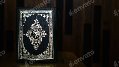 Preview: Closeup shot of the Koran-the Holy book of Muslims on a wooden table