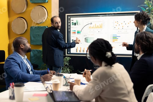 Preview: Team of business associates discussing ways to increase revenue