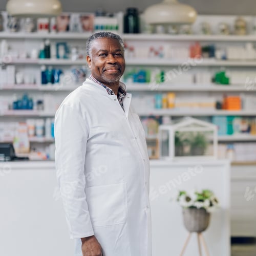 Preview: Portrait of a senior multicultural pharmacist smiling at the camera while standing in an apothecary.
