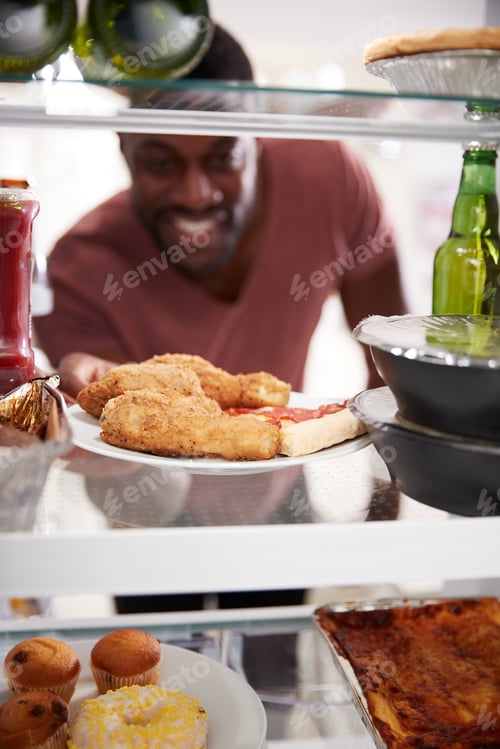 Preview: View Looking Out From Inside Of Refrigerator Filled With Takeaway Food As Man Opens Door