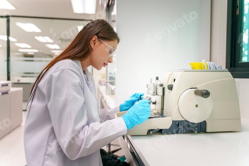 Preview: Scientist working in laboratory using precision equipment for analysis