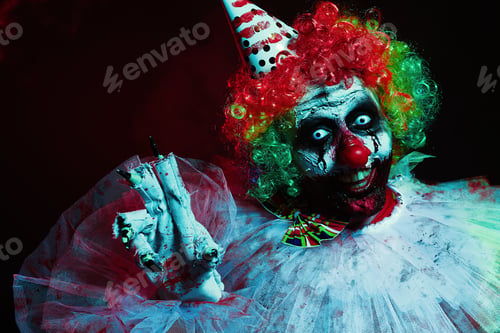 Preview: Terrifying clown on dark background. Halloween party costume